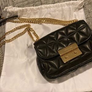 Michael Kors cross body gold chain bag.